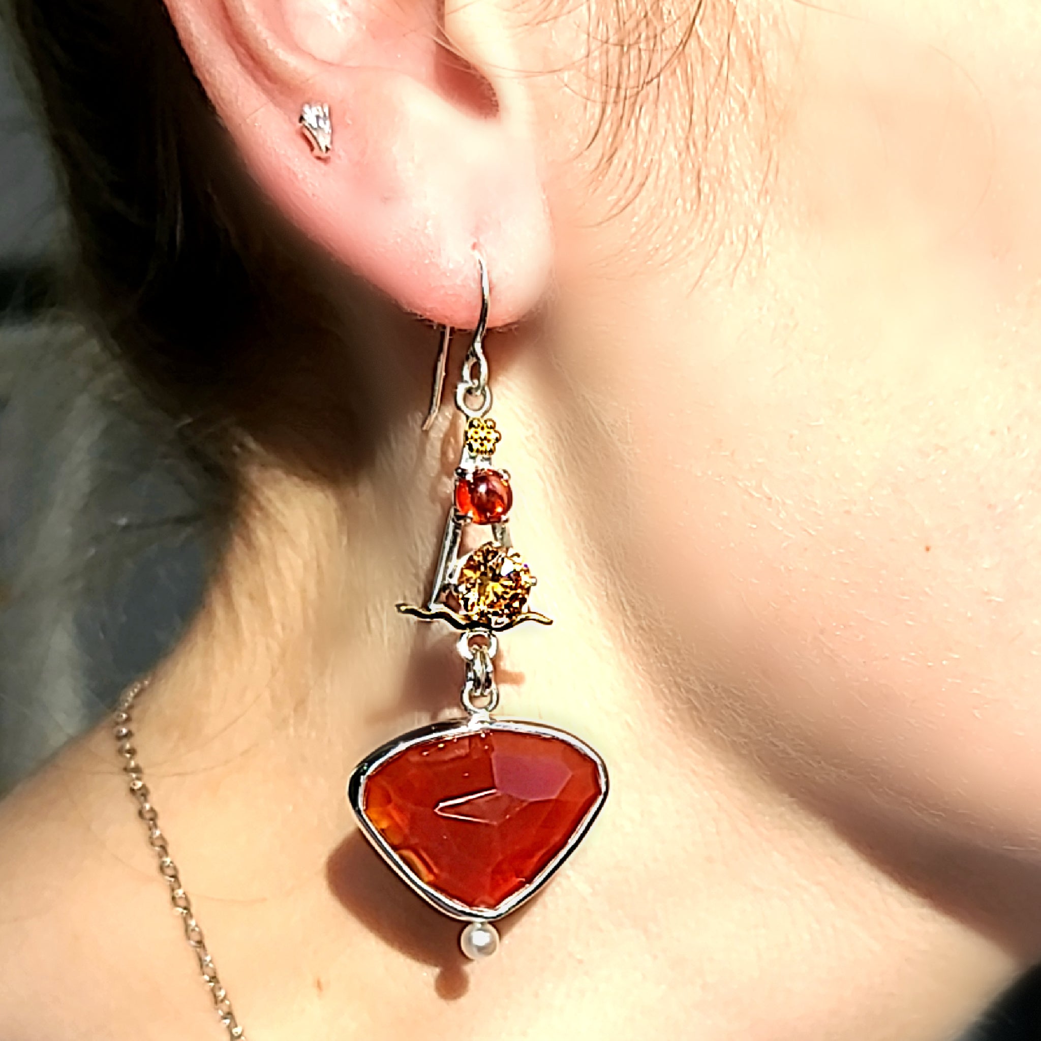 Model wearing Sterling Silver, Carnelian, Topaz Cubic Zirconia, Freshwater Pearls and 22k Gold accent earrings