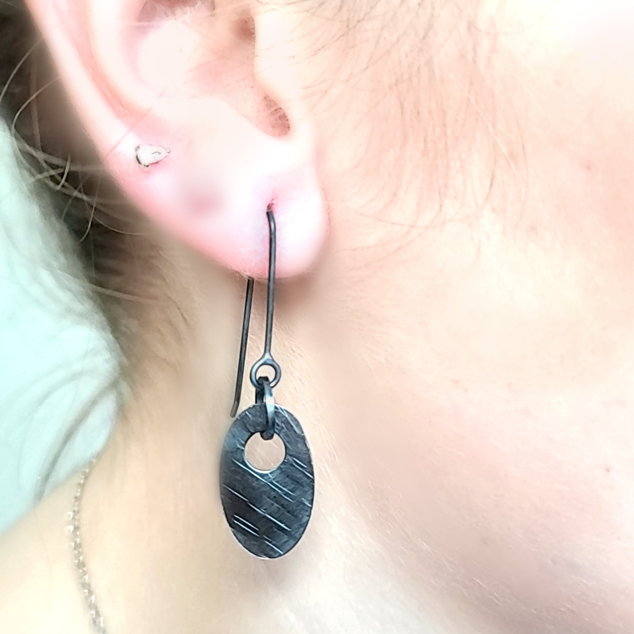 Model wearing Oxidized and hammered Sterling Silver earrings