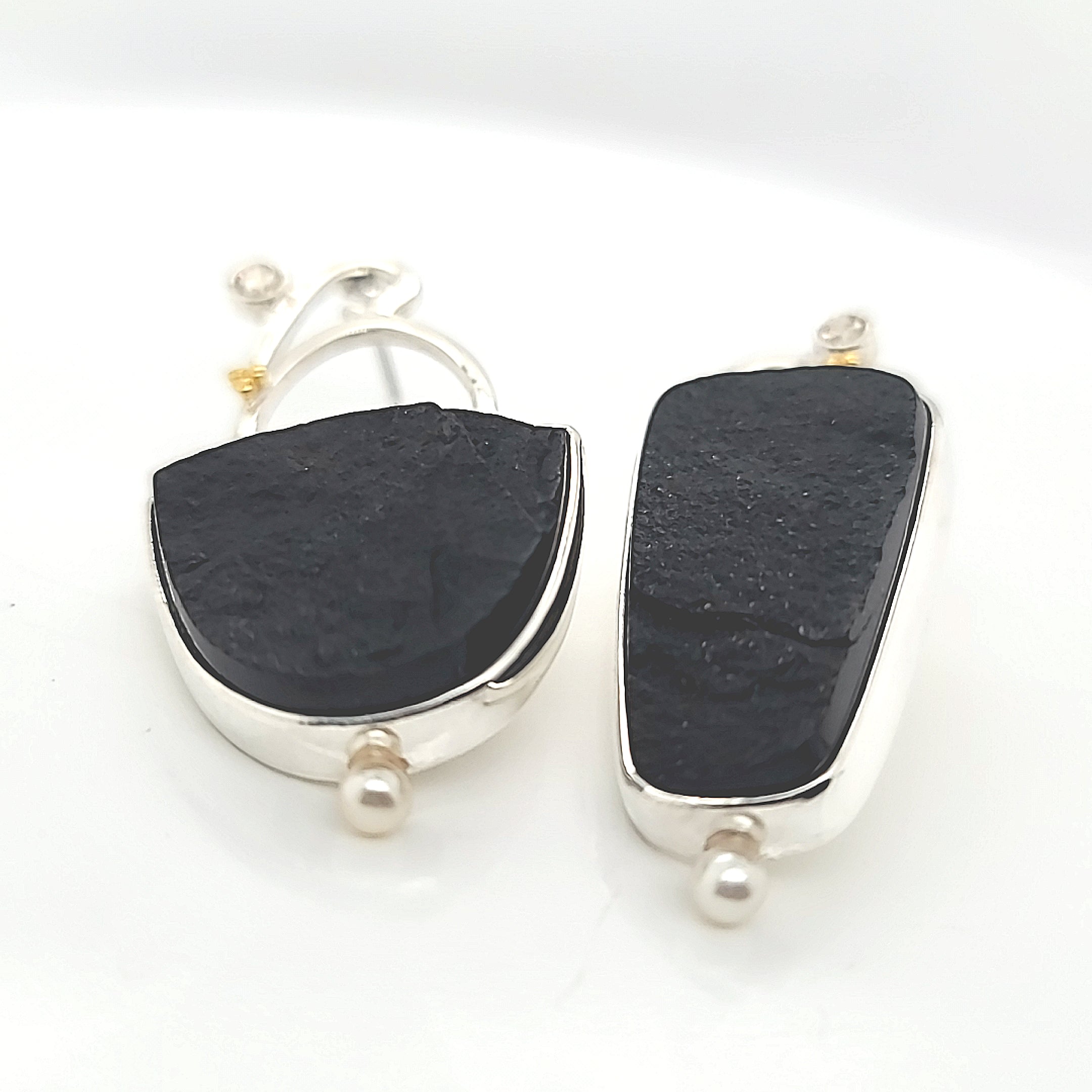Asymmetric Natural Surface Black Onyx, Cubic Zirconia and Freshwater Pearls set in Sterling Silver with 22k Gold accents.