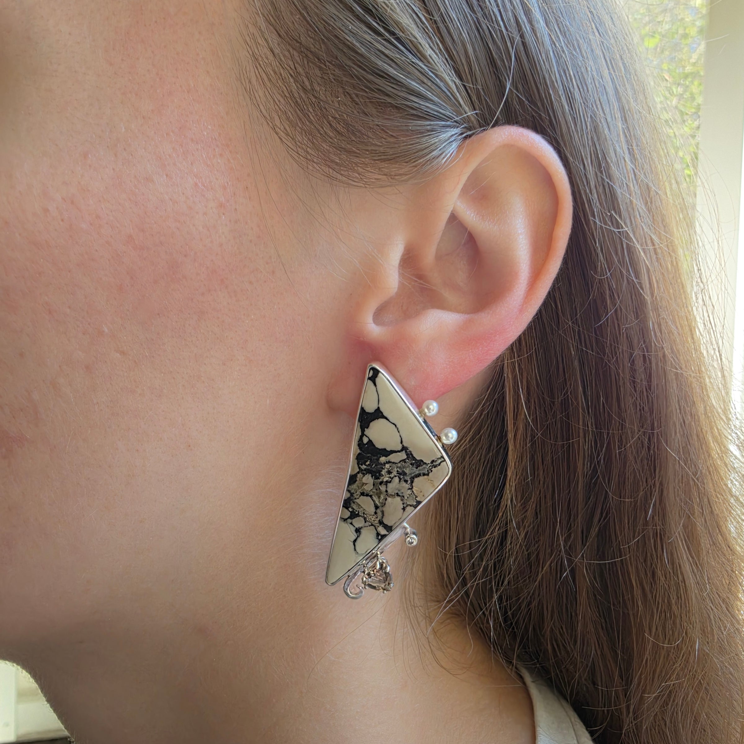 Modeling picture of Markasite earrings set in Sterling Silver with Smoky Quartz, Cubic Zirconia and Freshwater Pearls.