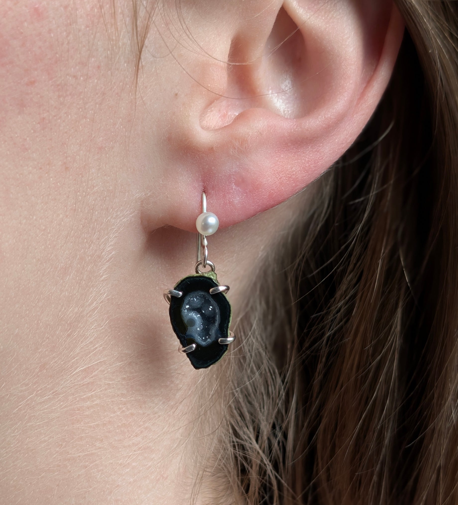 Model wearing Agate Drusy with Freshwater Pearl earrings set in Sterling Silver.