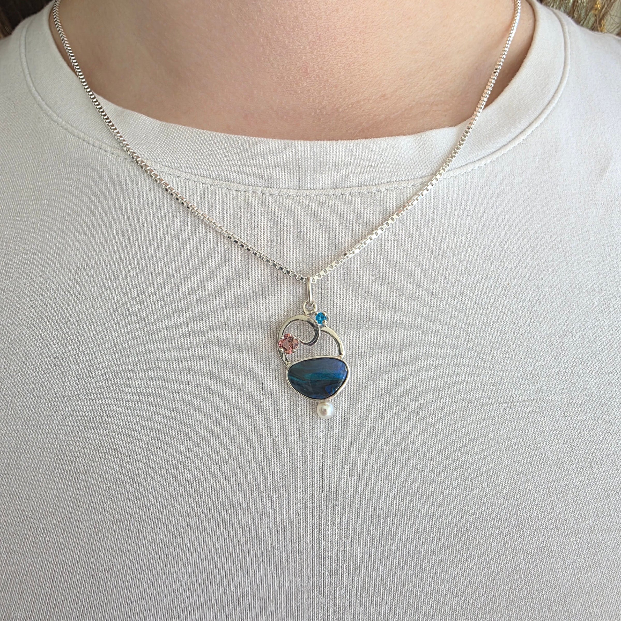 Model wearing Opal, Apatite, Pink Tourmaline and Freshwater Pearl Pendant set in Sterling Silver with 18 inch Sterling Silver chain.