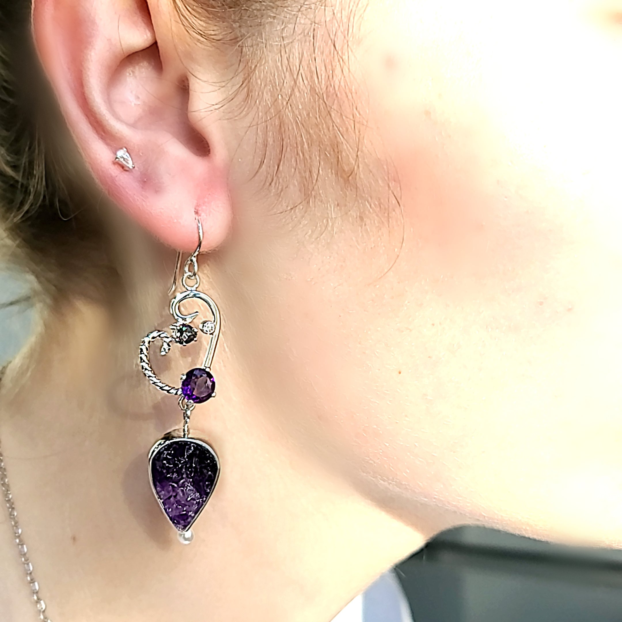 Model wearing Sterling Silver, Natural surface Amethyst, Mystic Topaz, Faceted Amethyst, Cubic Zirconia and Freshwater Pearl earrings