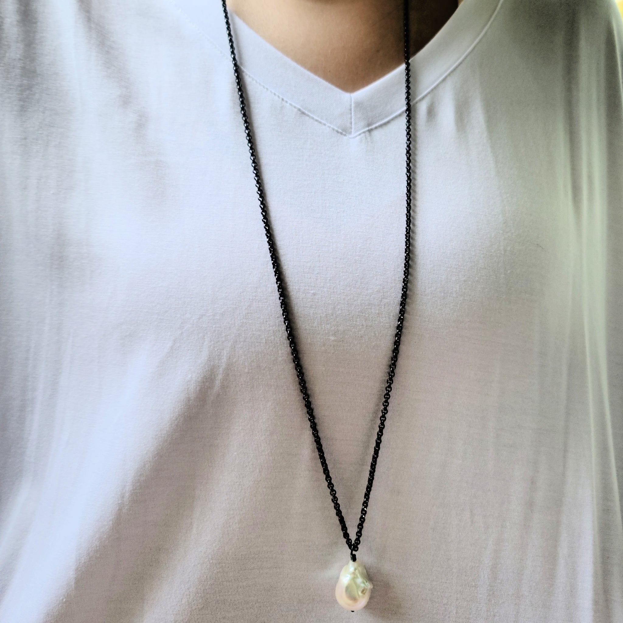 Model wearing Oxidized Sterling with Freshwater Pearl pendant with Base metal chain